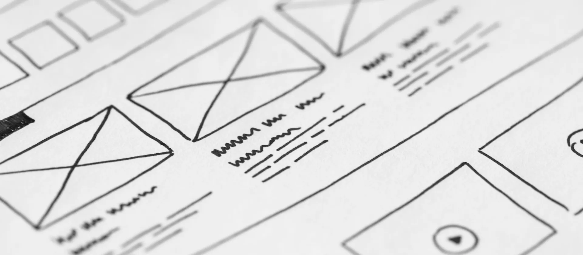 Hand-drawn interface wireframes showing content blocks and screen structure.