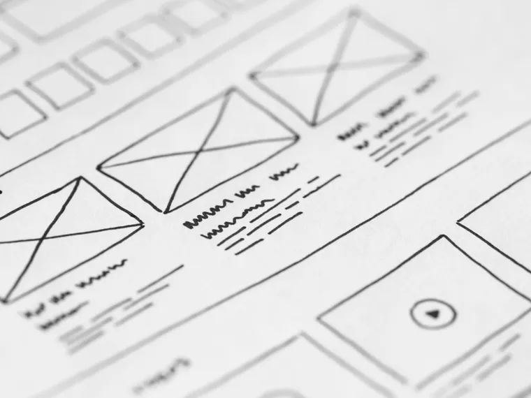 Hand-drawn interface wireframes showing content blocks and screen structure.