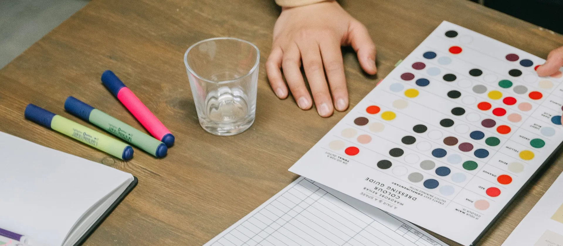 Colour references and markers on a creative working table.
