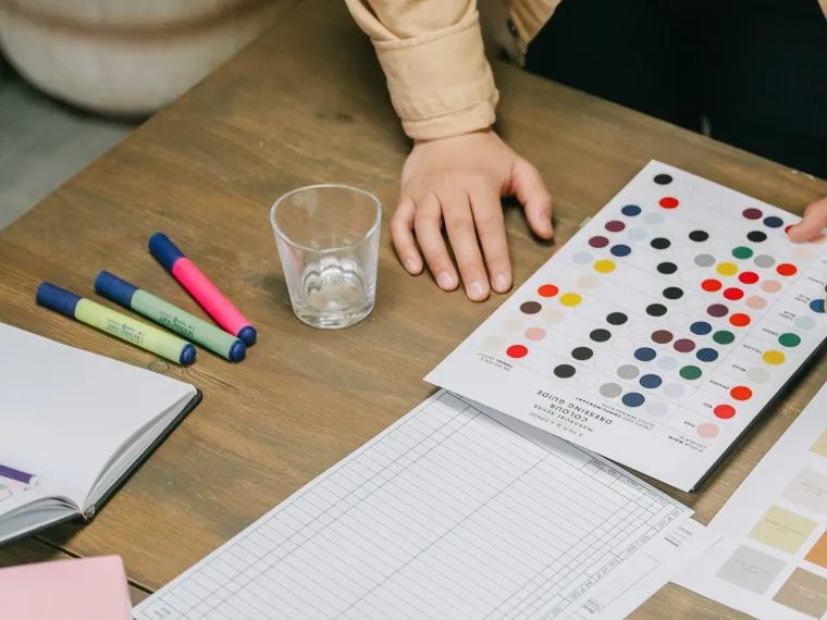 Colour references and markers on a creative working table.