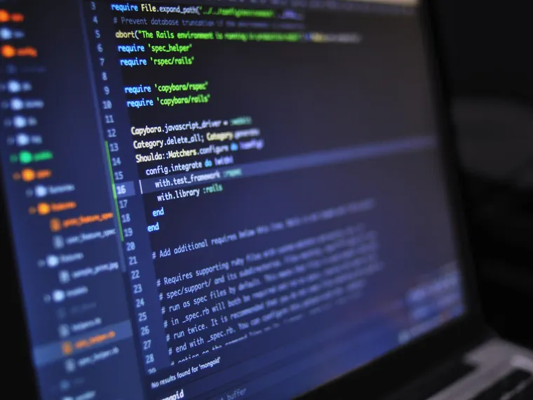 A close-up of source code on a screen, illustrating the technical side of a website review.