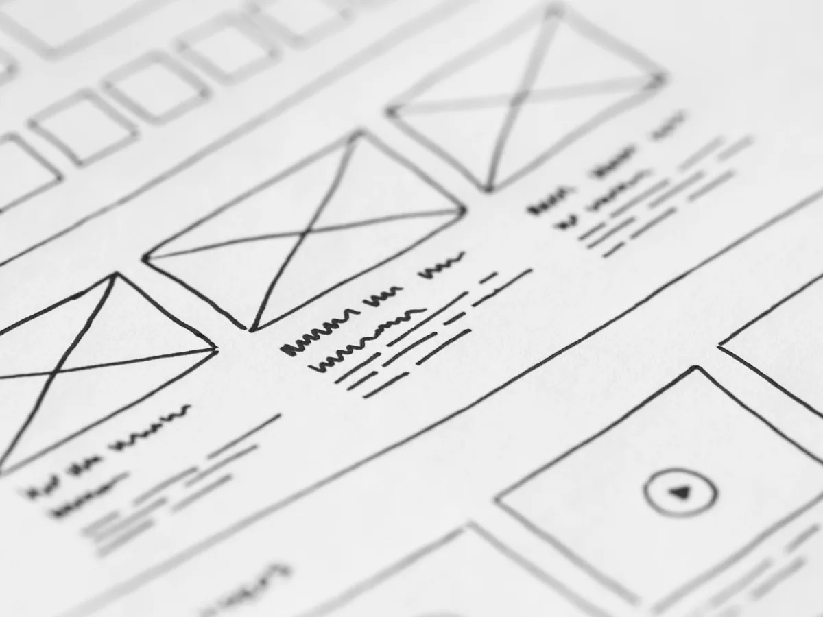 Paper wireframes outlining a website layout